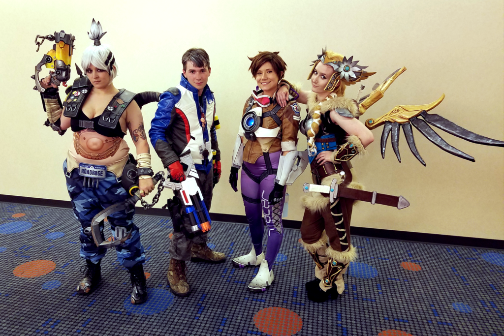 Valkyrie Mercy Cosplay at Gen Con 2016 - with Ginoza Costuming as genderbent Roadhog, a Soldier 76 cosplayer, and AshTheStampede as Tracer