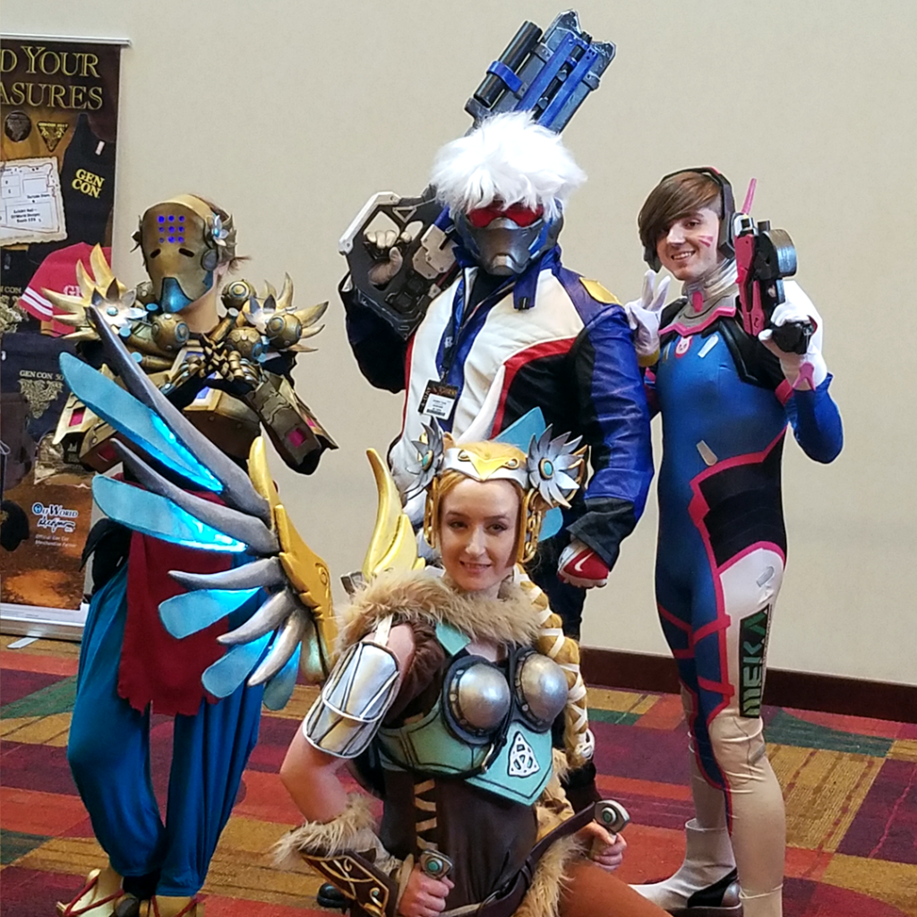 Valkyrie Mercy Cosplay at Gen Con 2017 - with group of Overwatch Cosplayers