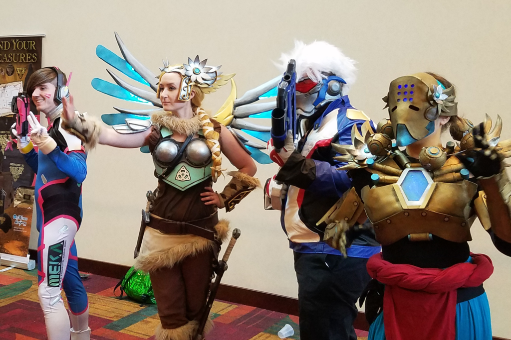 Valkyrie Mercy Cosplay at Gen Con 2017 - with group of Overwatch Cosplayers