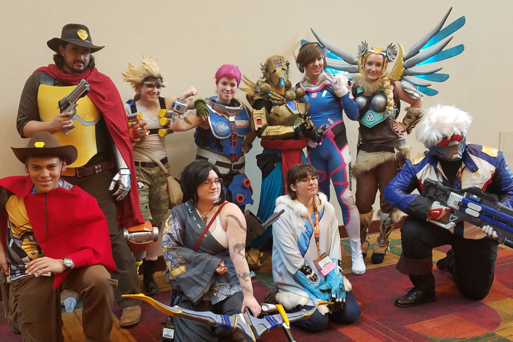 Valkyrie Mercy Cosplay at Gen Con 2017 - with group of Overwatch Cosplayers