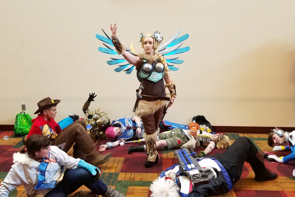 Valkyrie Mercy Cosplay at Gen Con 2017 - with group of Overwatch Cosplayers