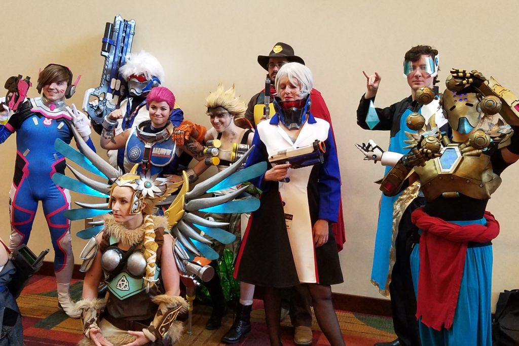 Valkyrie Mercy Cosplay at Gen Con 2017 - with group of Overwatch Cosplayers